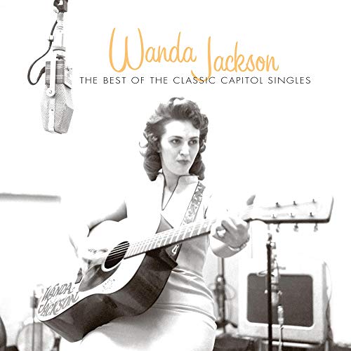 Wanda Jackson album cover featuring a black and white photo of her playing guitar.