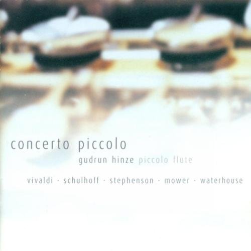 A CD cover featuring a piccolo on a reflective surface with pebbles.