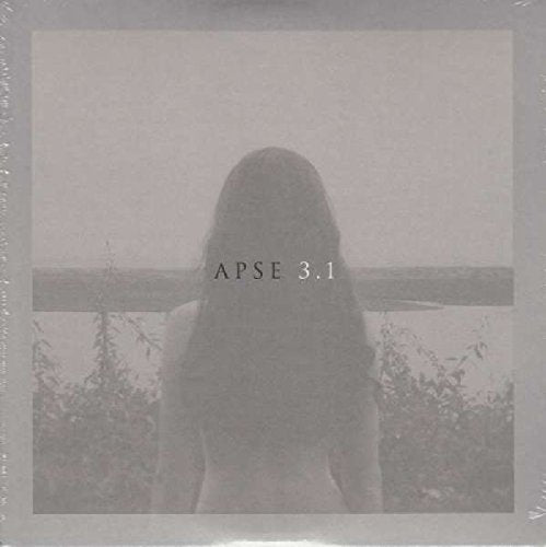 A vinyl record cover featuring a woman standing behind a wooden fence outdoors.