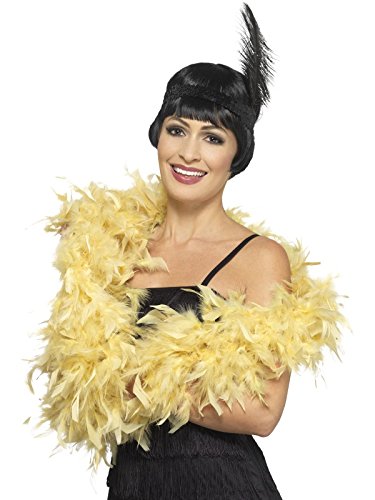 "Woman wearing a black flapper dress, yellow feather boa, and black feathered headpiece."