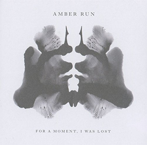 "CD album cover with symmetrical inkblot design and text 'Amber Run' and 'For A Moment, I Was Lost'."