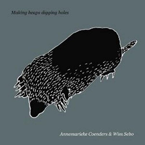 "CD cover art featuring a black mole on a gray background."