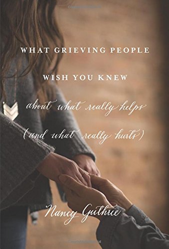 "Book cover with two people holding hands and title 'What Grieving People Wish You Knew'."