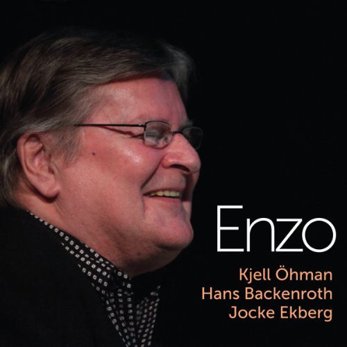 CD album cover with a smiling man and text "Enzo" against a black background.