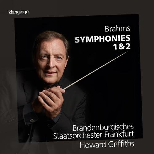 "CD cover with a man holding a conductor's baton, against a black background."