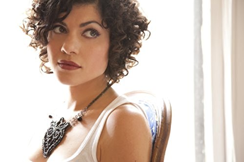 Album cover with a woman wearing a white tank top and a necklace.