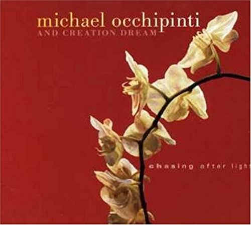 "CD cover with red background, white flowers, and artist's name 'Michael Occhipinti'."
