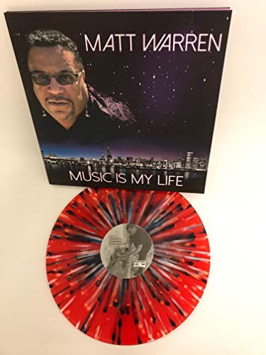 Album cover with a man's portrait and city skyline at dusk.