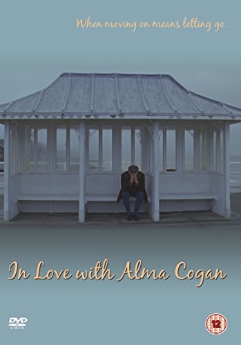 "DVD cover with couple sitting in a white gazebo, grey background, cursive text."
