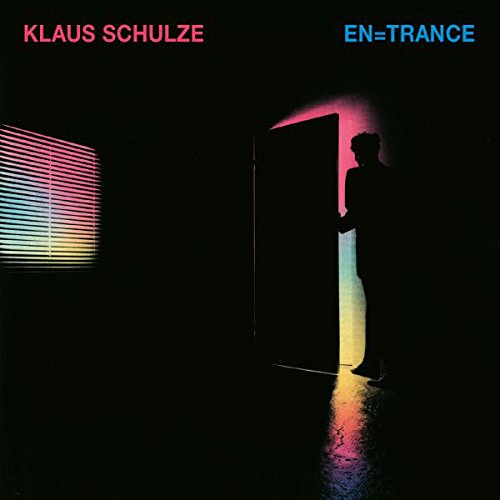 "Album cover featuring a silhouette of a man stepping through a doorway with rainbow light."