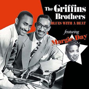 Black and white photograph of two men and one woman on a red and black album cover.