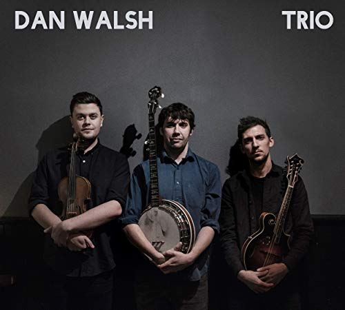 Album cover featuring three men holding stringed instruments against a dark background.