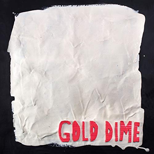 The alt text is: "White crumpled paper with 'GOLD DIME' in red on a black background."