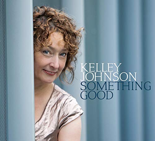 "Kelley Johnson's album cover: a smiling woman peeking from behind a blue curtain."