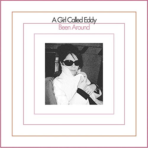 Vinyl album cover with a black and white photo of a person wearing sunglasses.