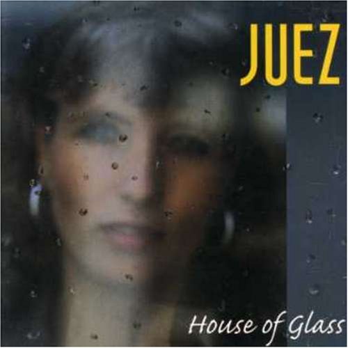 Blurry image of a woman's face behind a rain-stained window with text overlay.