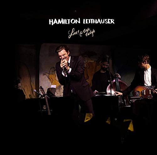 Vinyl album cover featuring a man singing into a microphone with two musicians.