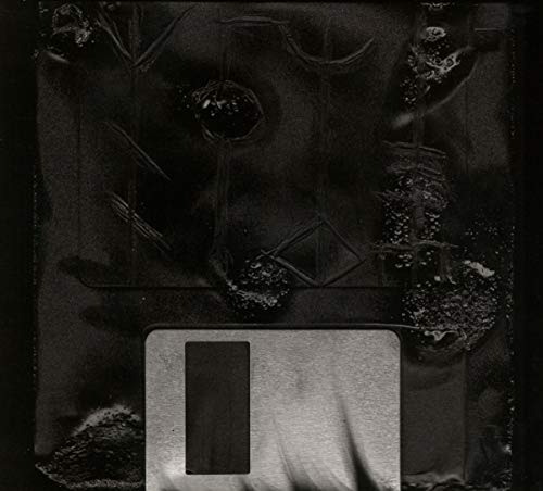 A CD case with a floppy disk design, featuring a dark, grungy aesthetic.
