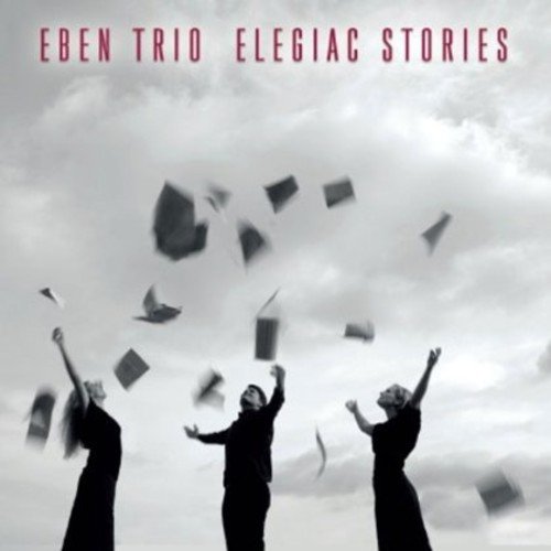 "CD cover featuring three silhouetted figures throwing papers against a cloudy sky."