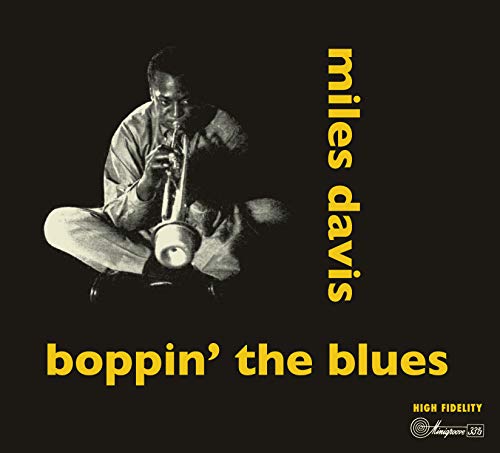 CD cover with black background, man playing trumpet, and yellow text "miles davis boppin' the blues".