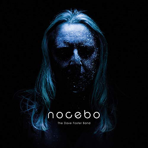 Album cover featuring a man with long hair and a dark, shadowy face.