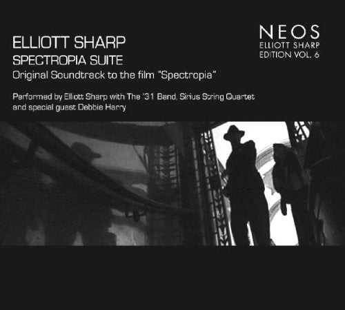 Black CD cover with white text and silhouetted figures in a dark room.