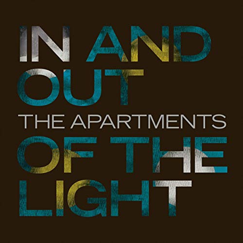 "Album cover with 'In and Out of the Light' in large, distressed text on a dark background."
