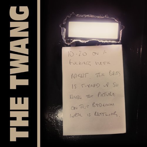"Album cover with handwritten note on paper, attached to a black background."