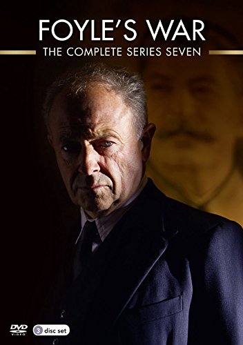 DVD cover featuring a man in a suit with a blurred background image.