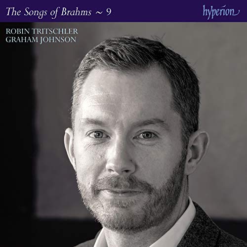 Black and white headshot on a CD cover with purple banner.
