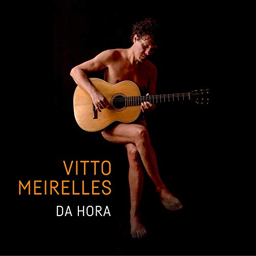 Album cover with a man playing guitar, partially nude, against a black background.