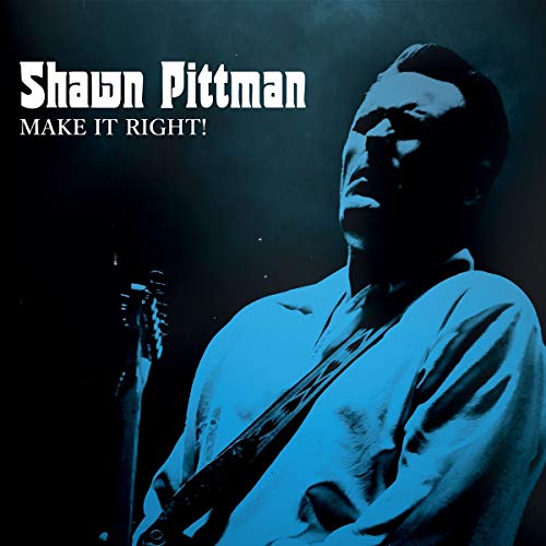 CD cover with a man holding a guitar, blue-toned, against a dark background.