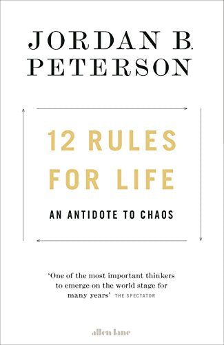 "White book cover with '12 Rules for Life' in orange and black text."