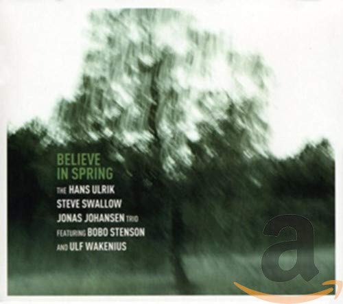 CD cover with blurred tree image and album title "Believe in Spring".