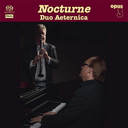 "CD cover featuring a clarinetist and pianist on a dark background with yellow text."