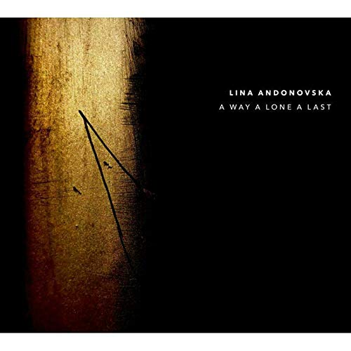 Music album cover with a dark background, gold stripe, and black arrow graphic.