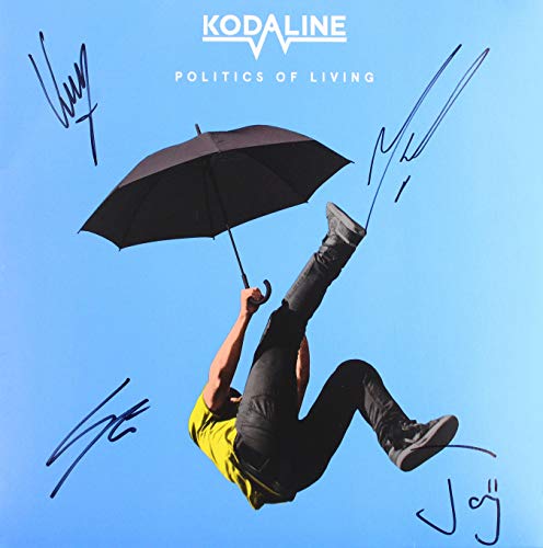 "Man hanging upside down from black umbrella against blue background, signed album cover."