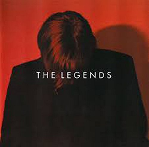 A man in a black jacket against a red background with "THE LEGENDS" text overlay.