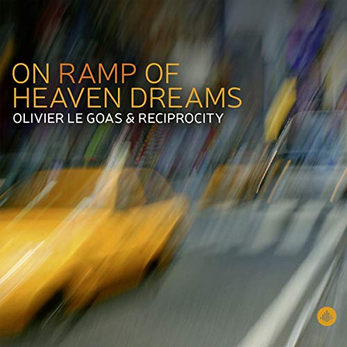 "Blurry image of a yellow taxi cab on a city street at night."