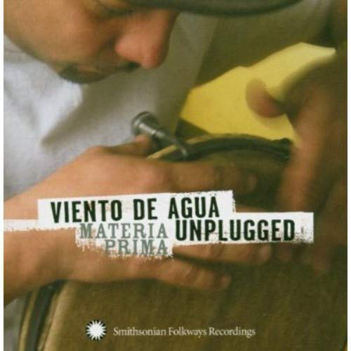 The alt text for the image is: "CD cover with a man working on a musical instrument."