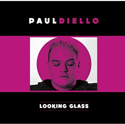 Album cover with a man's portrait, magenta and black background, and white text.