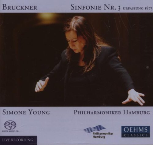 CD cover featuring a woman conductor with outstretched hands, gray background, and black text.