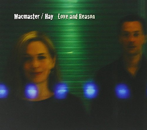 "CD cover featuring a man and woman with blue lights, green background."
