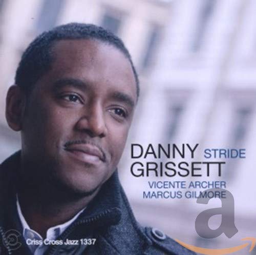 "CD cover with a man in a jacket, text reads 'Danny Grissett Stride'."