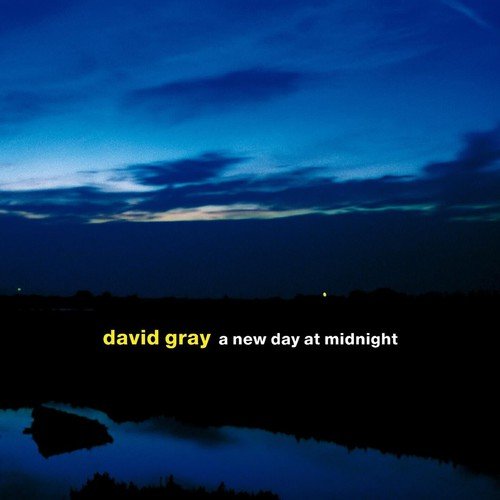"Album cover with a serene dusk landscape and text 'david gray a new day at midnight'."
