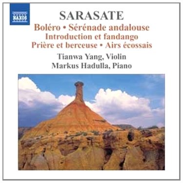 A CD cover featuring a rocky landscape with a blue sky and clouds.
