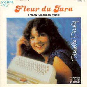 CD cover featuring a smiling woman holding an accordion against a blue background.