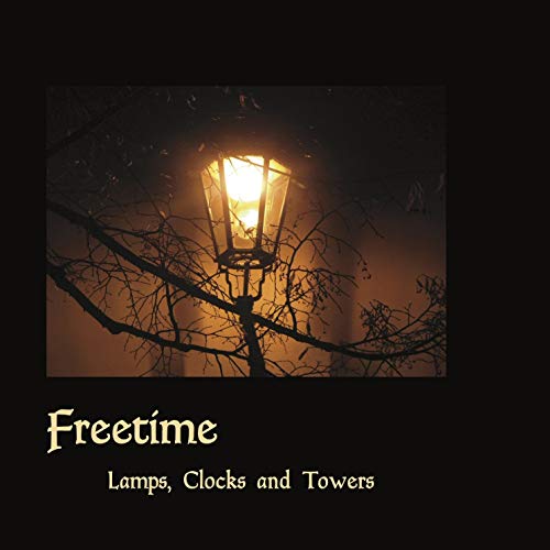 A CD cover featuring a lit street lamp surrounded by bare tree branches at dusk.