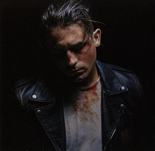 Man with blood on his face and shirt, wearing a black leather jacket.