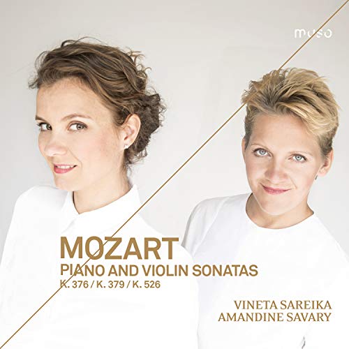 CD cover featuring two women in white, with gold text and diagonal line.